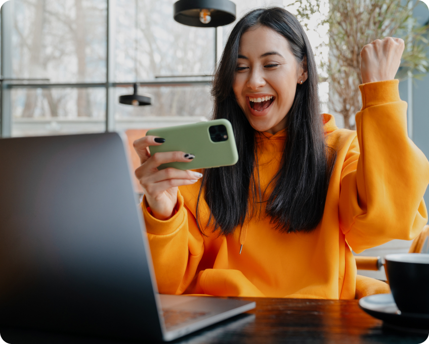 girl is looking to the phone with a sweet smile